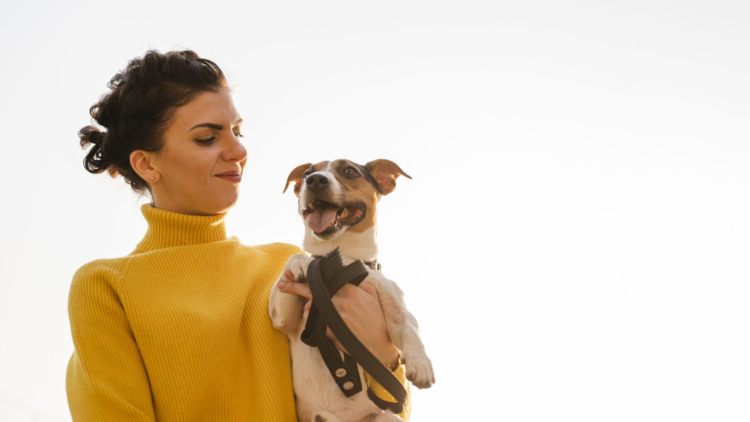 happy-woman-with-her-dog-outdoors